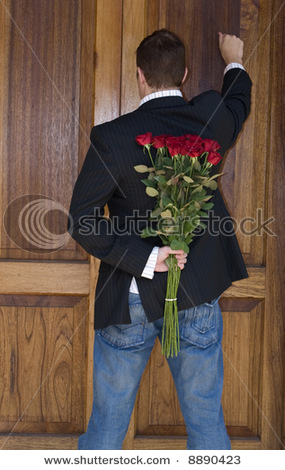 stock-photo-man-knocking-on-door-to-present-flowers-to-his-date-on-valentines-day-8890423.jpg